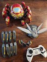 Full set showing Spider-Bot with Iron Man skin, Wasp skin parts and remote