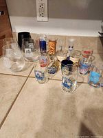 Group of stemless wine and shot glasses on counter
