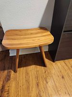 Full view of stool beside cabinet