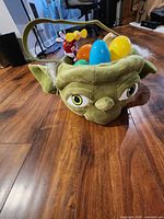 Yoda plush basket front view with eggs and M&M fan visible