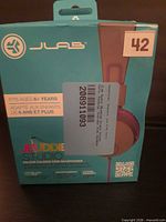 Front of JLab JBuddies Studio headphone retail box with product details