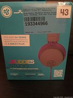 Front of retail box displaying JLab Audio JBuddies Studio kids headphones and product details