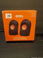 Front of retail box showing onn. USB Stereo Speakers image and cable length information