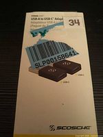 Front of StrikeLine box showing two USB-A to USB-C adapters and product labeling