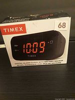 Front of retail box showing clock image and features