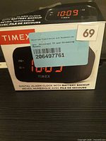 Front of retail box showing clock image and Timex branding
