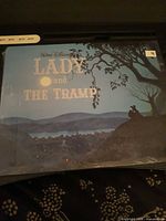 Front view of factory-sealed Walt Disney "Lady and the Tramp" lithograph showing artwork and title