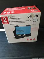 Front of boxed VTech 2-handset cordless answering system showing product image and model information