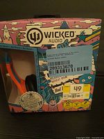 Front view of Wicked Audio Kids Rad Rascal headphones box showing brand, series, model and retail stickers