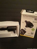 Box front and transmitter in plastic tray