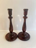 Front view of both mahogany candlesticks
