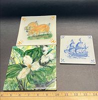 All three tiles with ruler for scale