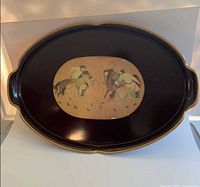 Full view of oval lacquered tray showing shape, handles and artwork