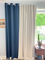 Navy and ivory curtain panels hung together showing length and color contrast