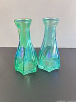 Front view of both iridescent glass bud vases