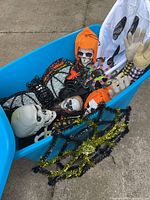 Overall view of blue tote filled with assorted Halloween decorations