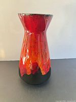 front view of red-orange fat lava ceramic vase