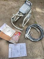 Sprayer unit on stand, hose, spray gun, accessory box, manuals