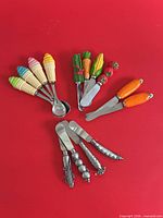 Overview of all 14 utensils on red background