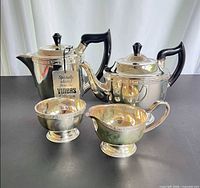 Full view of the four-piece Viners silver plated set