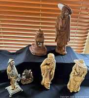 Overall lot showing six figurines