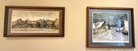 Both framed lithographs hanging on wall