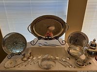 Full set laid out showing trays, urn, utensils and other pieces