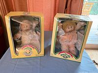 Both boxed Cabbage Patch Kids Preemie dolls side by side