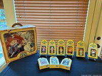 Group shot showing boxed World Traveller doll and nine boxed posable figures