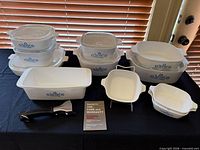 Full assortment of Cornflower dishes, lids, loaf pan, square dishes, handle and booklet