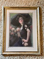 Framed print of woman in black dress holding roses