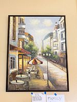 Full view of framed canvas on wall