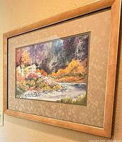 Full view of framed watercolor on wall