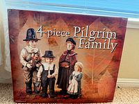 Retail box showing 4-piece Pilgrim Family set