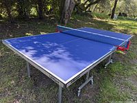 Full view of Killerspin MyT4 table tennis table assembled outdoors