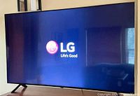 LG TV powered on displaying LG logo