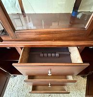 Interior of lower drawers, felt lining and storage