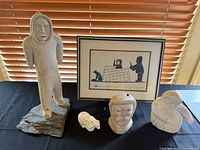 Group shot of all five items including sculptures, ceramic bear, and framed print