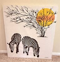 Front view showing full safari scene with two zebras, tree, and sun