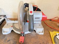 Ridgid AC3030 miter saw front view on workbench