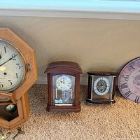 All four clocks lined up for scale and comparison
