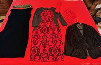 Full lot showing three garments and accessories laid out