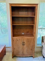 Front view of entire shelving unit closed