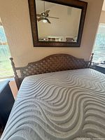 Close-up of lattice headboard and turned posts