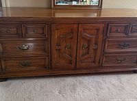 Front view of long dresser showing drawer layout and hardware