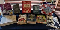 Group shot of all twelve vintage cookbooks