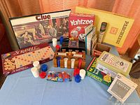 Overall lot with board games, chip caddy, loose chips and domino box