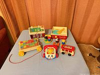Group shot of all Fisher-Price toys on table