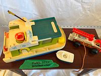 Top view of houseboat, dinghy, and fire truck