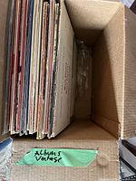 Stack of LPs in box showing quantity